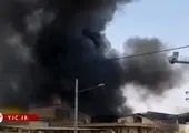 آتش سوزی در میدان بهارستان تهران + فیلم